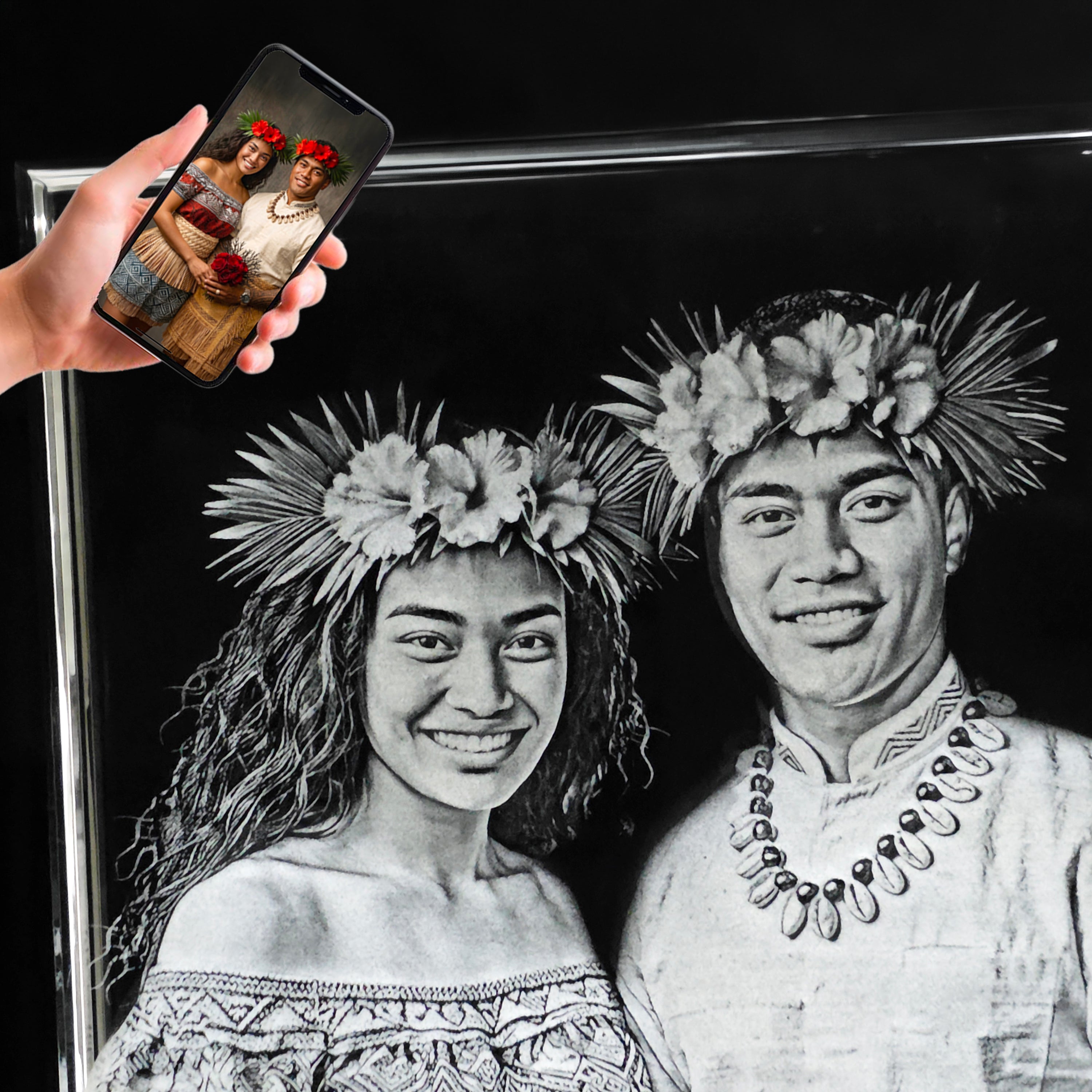 A closeup of a jumbo 3D photo crystal rectangle shaped crystal with a Samoan couple laser engraved inside.